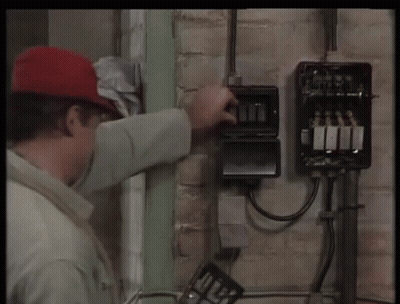 Man In Red Hat Working On Electrical Box GIF