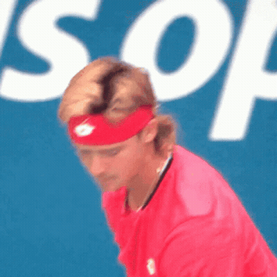 Man In Red Headband And Red Shirt In Front Of Son Sign GIF