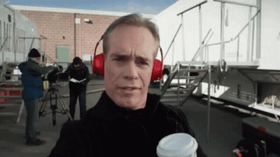 Man In Red Headphones Holding Coffee Cup GIF