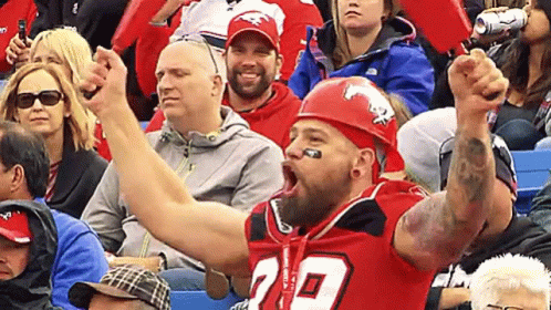 Man In Red Helmet And Jersey Sitting GIF
