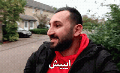 Man In Red Hoodie And Black Jacket With Arabic Writing GIF