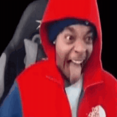 Man In Red Hoodie And Red Vest Sticking Tongue Out GIF