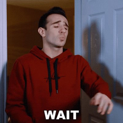 Man In Red Hoodie At Door Saying Wait GIF