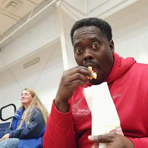 Man In Red Hoodie Eating Popcorn GIF