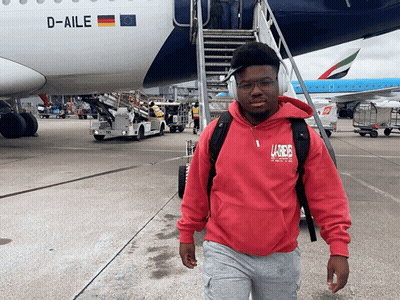 Man In Red Hoodie In Front Of D-Aile Plane GIF