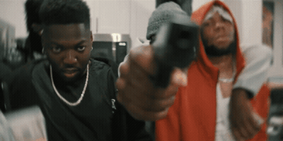 Man In Red Hoodie Pointing Gun At Another Man GIF