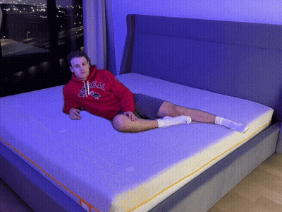 Man In Red Hoodie Saying Real On Mattress GIF