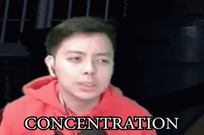 Man In Red Hoodie With Concentration GIF