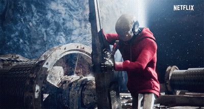 Man In Red Hoodie Working On Machine GIF