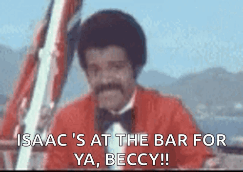 Man In Red Jacket And Bow Tie Says Isaac At Bar GIF