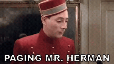 Man In Red Jacket And Hat Saying Paging Mr. Herman GIF