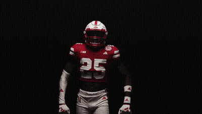 Man In Red Jacket And Red Hat With Huskers GIF