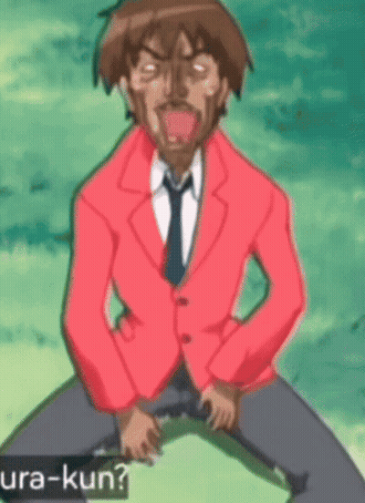 Man In Red Jacket And Tie Kneeling With Ura-Kun GIF