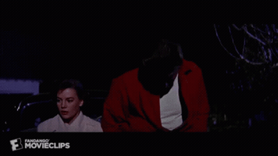 Man In Red Jacket And Woman In White Coat GIF