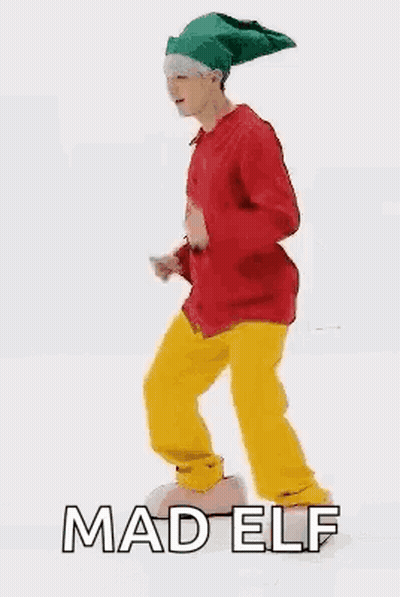 Man In Red Jacket And Yellow Pants Elf Dancing GIF