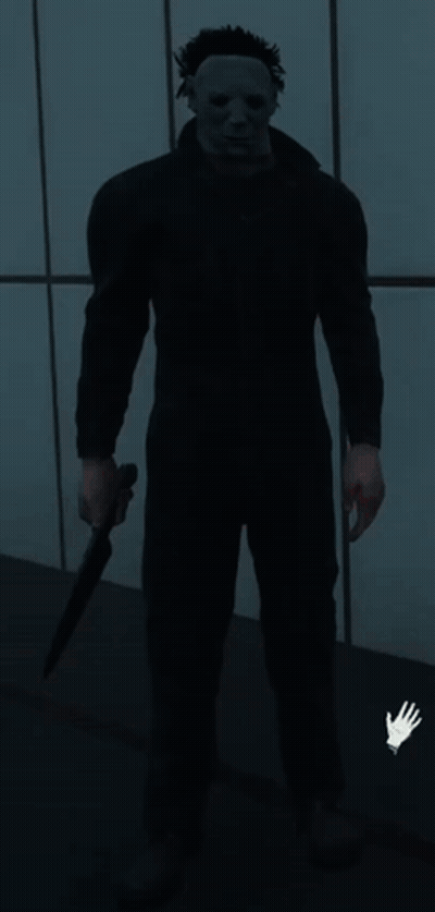 Man In Red Jacket And Yellow Shirt Eyes Closed In Kitchen GIF