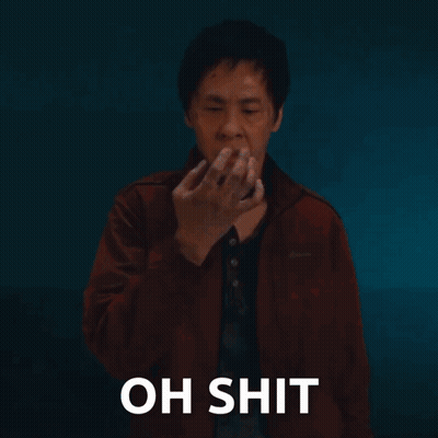 Man In Red Jacket Covering Mouth Saying Oh Shit GIF