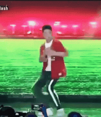Man In Red Jacket Dancing In Green Field GIF