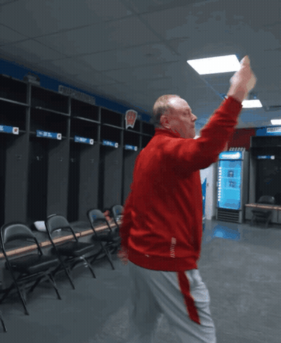 Man In Red Jacket Dancing In Locker Room With Number 2 GIF