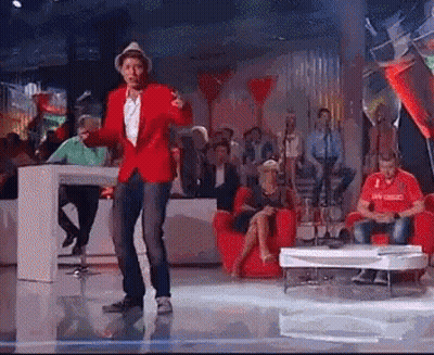 Man in Red Jacket Dancing on Stage
