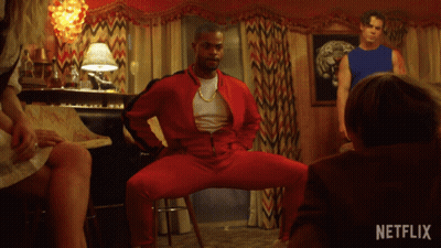 Man In Red Jacket Dancing With Netflix Logo GIF