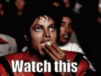 Man In Red Jacket Eating Popcorn Watching Movie GIF