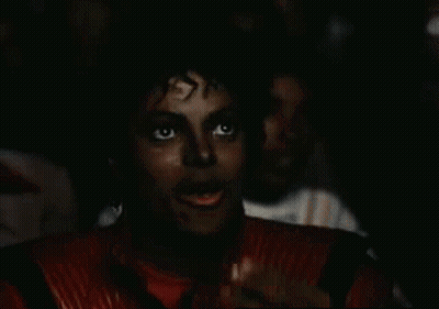 Man In Red Jacket Eating Popcorn Watching Movie GIF