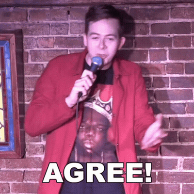 Man In Red Jacket Holding Microphone GIF