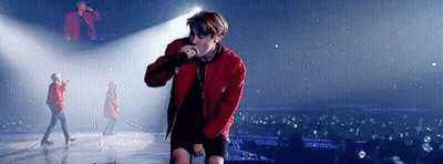 Man In Red Jacket Holding Microphone GIF