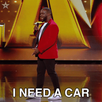 Man In Red Jacket Holding Microphone Says I Need A Car GIF