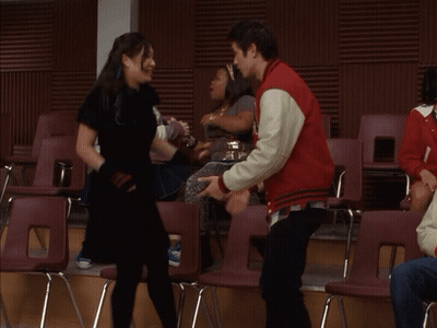 Man In Red Jacket Holding Woman's Hand GIF