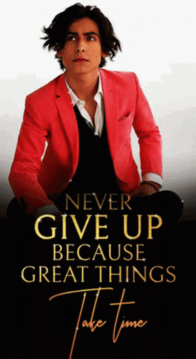 Man In Red Jacket In Front Of Never Give Up Sign GIF