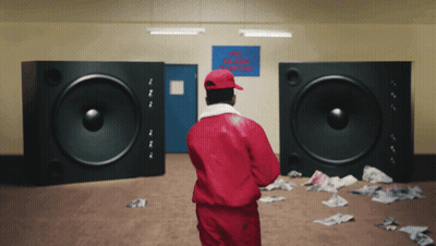 Man In Red Jacket In Front Of No Smoking Sign GIF