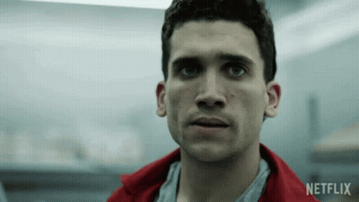 Man In Red Jacket Looking At Camera With Netflix Logo GIF