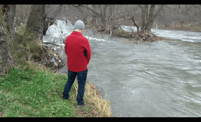 Man In Red Jacket Looking At River GIF