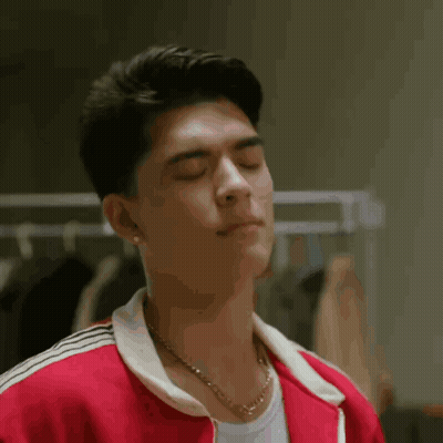 Man In Red Jacket Making Peace Sign GIF