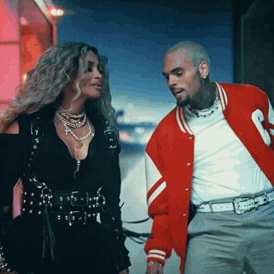 Man In Red Jacket Next To Woman GIF