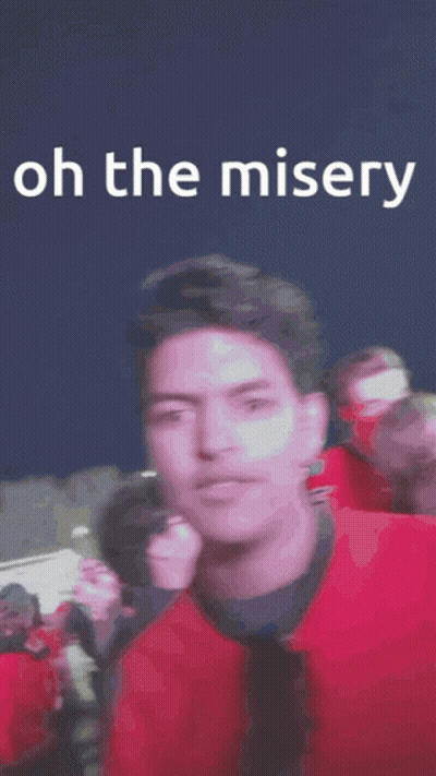 Man In Red Jacket Number 5 In Crowd GIF