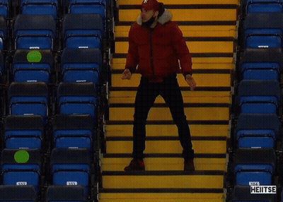 Man In Red Jacket On Stadium Stairs With Heitse GIF