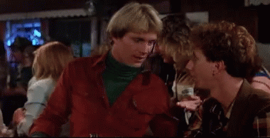 Man In Red Jacket Pointing At Smiling Man GIF