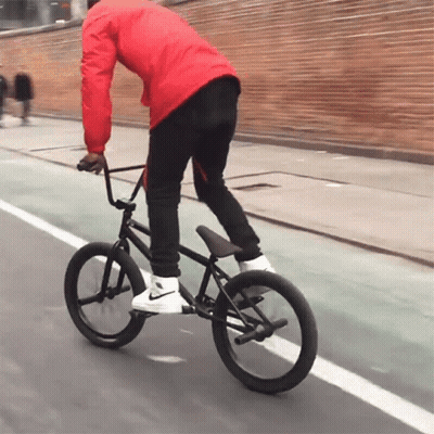 Man In Red Jacket Riding Bicycle GIF