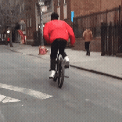 Man In Red Jacket Riding Bicycle GIF