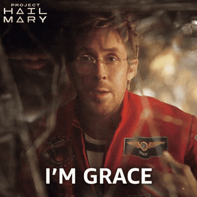 Man In Red Jacket Says I'm Grace In Front Of Project Hail Mary Poster GIF