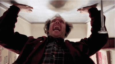 Man In Red Jacket Screaming Looking Up At Boxes 0129 GIF