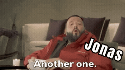 Man In Red Jacket Sitting On Couch Jonas Another One GIF