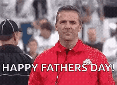Man In Red Jacket Standing In Front Of Crowd GIF