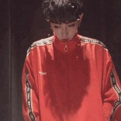 Man In Red Jacket Standing Next To Another Man GIF