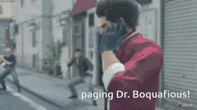 Man In Red Jacket Talking On Cell Phone Paging Dr. Boquacious GIF