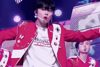Man In Red Jacket Wearing Washington Magazine Shirt GIF