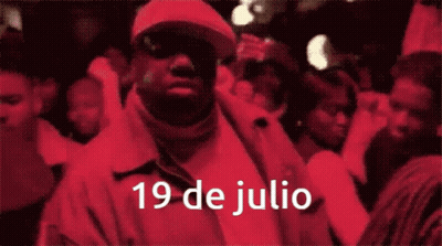 Man In Red Jacket With 19 De Julio GIF